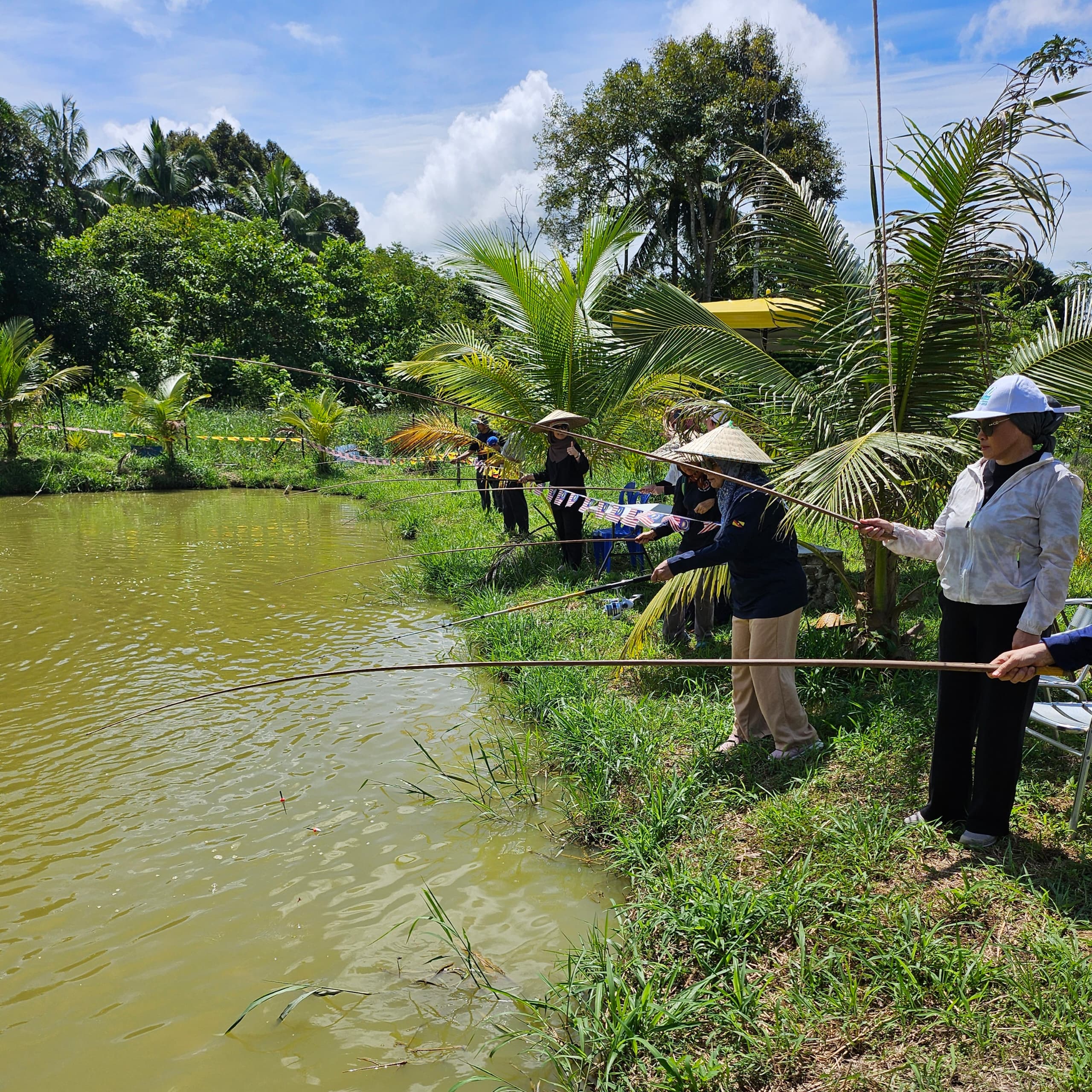 Visitors enjoying recreational fishing at Pond 1, CMN Fish Farm