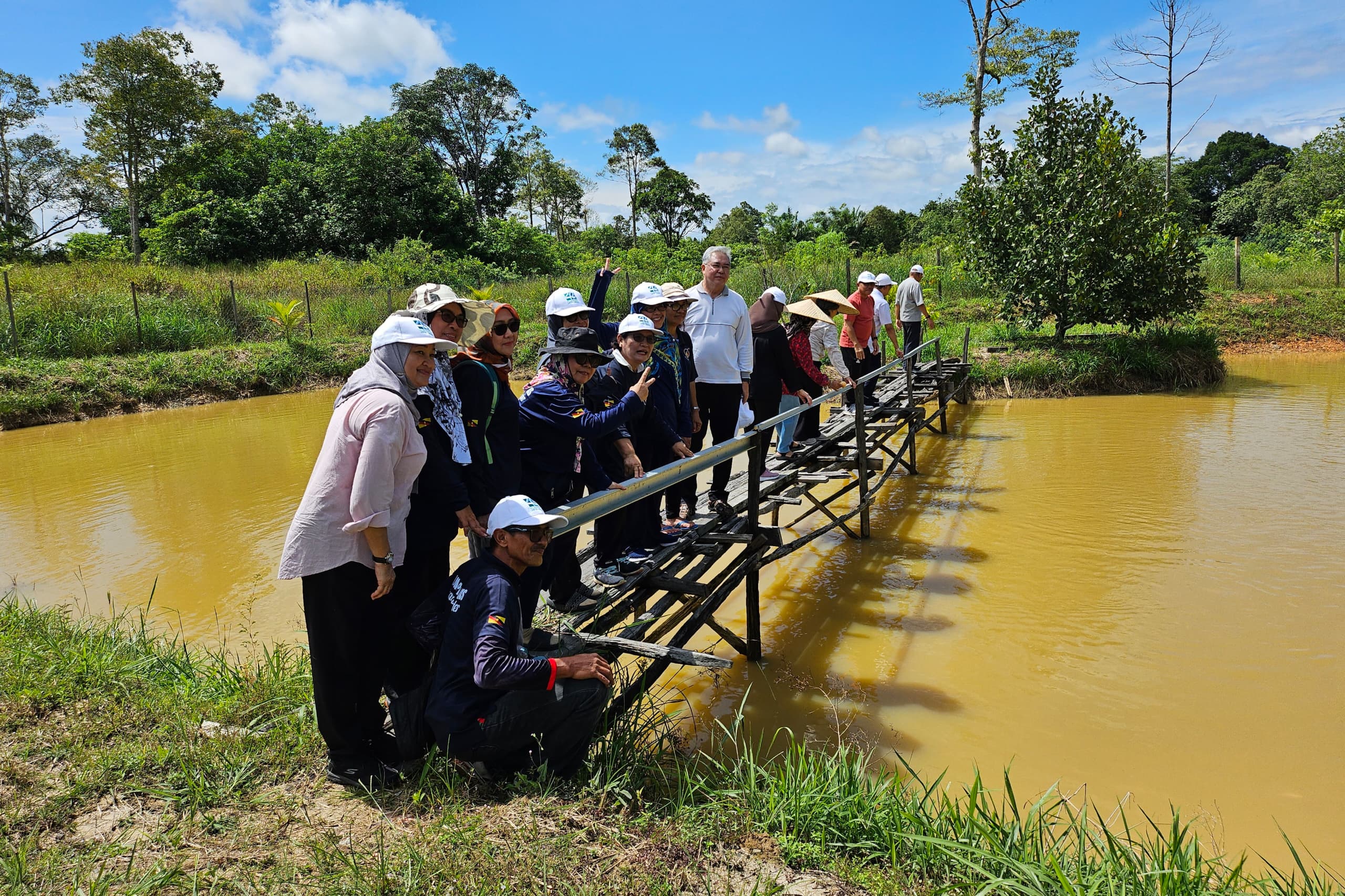 A happy group exploring the wooden jetty at Pond 2